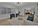 Living room with contemporary furnishings and access to dining area at 2421 Healy Dr, Orlando, FL 32818