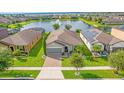 Single-Gathering home with solar panels, located on a lake with a fountain at 2662 Tahoe Ter, St Cloud, FL 34771