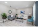 Bright living room featuring light flooring and comfy seating at 309 Albany Ave, Deland, FL 32724