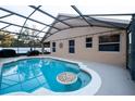 Screened pool with a patio and swim-up bar at 3202 Alling, Deltona, FL 32725