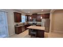 Modern kitchen with stainless steel appliances and an island at 3656 Brighton Park Cir, Orlando, FL 32812