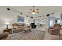 Spacious living room with a view into the dining area at 490 Sweetwater Way, Haines City, FL 33844