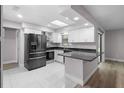 Modern kitchen featuring black appliances and granite countertops at 10140 Bridlewood Ave, Orlando, FL 32825