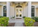 Elegant front entry with double doors and a welcoming porch at 107 Alexandra Woods Dr, Debary, FL 32713