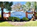 High Grove community entrance sign with lush landscaping at 142 Sandy Point Way, Clermont, FL 34714