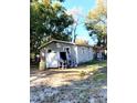 Side view of the house and a small shed at 2204 Suanee Ave, Eustis, FL 32726