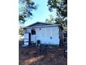 View of the back of the house with a yard at 2204 Suanee Ave, Eustis, FL 32726