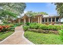 Front view of house showcasing landscaping and walkway to entrance at 451 Northwind Rd, Maitland, FL 32751