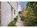 Sidewalk view with hedges and a glimpse of a car at 466 W Par St # 466, Orlando, FL 32804