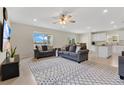 Spacious living room with two sofas and large TV at 5302 Royal Point Ave, Kissimmee, FL 34746