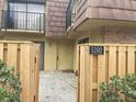 Townhome entrance with wood fence and gate at 5392 Elm Ct # 363, Orlando, FL 32811