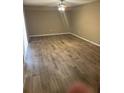 Spacious living room featuring wood-look tile floors at 5392 Elm Ct # 363, Orlando, FL 32811