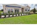 Front view of a one-story house with gray exterior at 5513 Hanover Square Dr, St Cloud, FL 34771