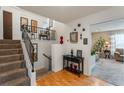 Bright entryway with staircase, console table, and view into living room at 602 Iris St, Altamonte Springs, FL 32714