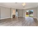 Spacious living room featuring a fireplace and sliding glass doors at 10812 Woodchase Cir, Orlando, FL 32836