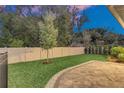 Private backyard with a spacious patio and lush green lawn at 1401 Lone Feather Trl, Winter Park, FL 32792