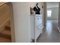 Spacious entryway with staircase and built-in shoe storage at 1794 Hackberry St, Clermont, FL 34715