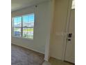 Bright living room with large windows offering scenic views at 1794 Hackberry St, Clermont, FL 34715