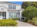 Two-story light blue house with navy blue shutters and landscaped front yard at 2546 Renshaw St, Kissimmee, FL 34747