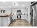 Modern kitchen with white cabinets and butcher block island at 300 S Brighton Dr, Port Orange, FL 32127