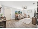 Living room with light gray walls and wood-look floors at 300 S Brighton Dr, Port Orange, FL 32127