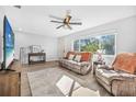 Living room with couch and recliner, wood-look floors at 300 S Brighton Dr, Port Orange, FL 32127