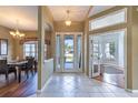 Bright entryway with tile flooring, leading to living and dining areas at 346 Hickory Springs Ct, Debary, FL 32713