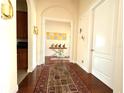 Elegant hallway with hardwood floors and art at 3764 Farm Bell Pl, Lake Mary, FL 32746