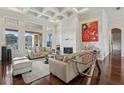 Living room with hardwood floors, fireplace, and access to pool at 3764 Farm Bell Pl, Lake Mary, FL 32746