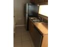 Kitchen with stainless steel appliances and double sink at 4653 Cason Cove Dr # 2713, Orlando, FL 32811