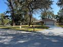 House exterior view from across the street, showcasing curb appeal at 5581 Aeolus Way, Orlando, FL 32808