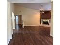 Spacious living area with a fireplace and wood-look flooring at 5581 Aeolus Way, Orlando, FL 32808