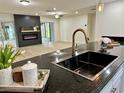 Modern kitchen features a large island, granite countertops, and stainless steel appliances at 10118 Allenby Ct, Orlando, FL 32821