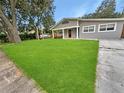 Spacious front yard with lush green grass at 1142 Grayson Dr, Orlando, FL 32825