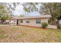 Inviting single-story home with a covered entry and well-maintained lawn, offering great curb appeal at 1335 Lescot Ln, Orlando, FL 32811
