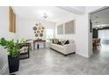 Light-filled living area featuring a comfortable sofa and tasteful decor at 1550 Outback Rd, St Cloud, FL 34771