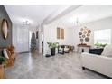 Open living room with neutral decor and access to other rooms at 1550 Outback Rd, St Cloud, FL 34771