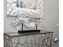 Modern entryway console table with decorative items at 1808 Sandy Park Trl, Kissimmee, FL 34747