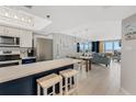 Modern kitchen with stainless steel appliances and island at 421 S Atlantic Ave # 105, New Smyrna Beach, FL 32169