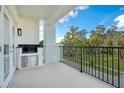 Private balcony with built-in grill and park views at 630 Vassar St # 2310, Orlando, FL 32804