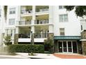 Apartment building exterior featuring balconies, stone accents, and a well-maintained entrance at 630 Vassar St # 2310, Orlando, FL 32804