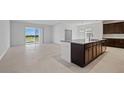 Open concept living space featuring tile flooring and sliding doors to the exterior at 7100 Cherry Pasture Rd, Groveland, FL 34736