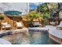 Private pool with patio furniture and lush landscaping at 815 E Pine St, Orlando, FL 32801