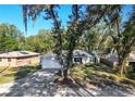 Aerial view of a gray house with a white garage door at 1253 15Th St, Orange City, FL 32763