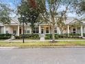Three-unit villa building showcasing well-maintained landscaping and street view at 2609 Corona Borealis Dr, Orlando, FL 32828