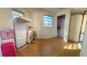 Simple bedroom with hardwood floors and a closet at 475 80 Foot Rd, Bartow, FL 33830