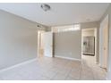 Bright and airy living room with tile floors at 5219 Montague Pl, Orlando, FL 32808