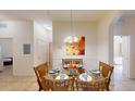 Glass dining table and chairs in a condo unit at 702 Rum Run # 38702, Davenport, FL 33897