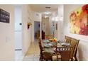 Condo dining area with glass table and wicker chairs at 702 Rum Run # 38702, Davenport, FL 33897