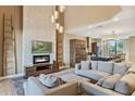 Spacious living area with fireplace and kitchen view at 7575 Brooklyn Dr, Kissimmee, FL 34747